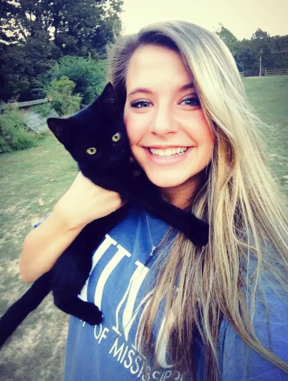 Whitney and Simon, who is a cat and knows it.
